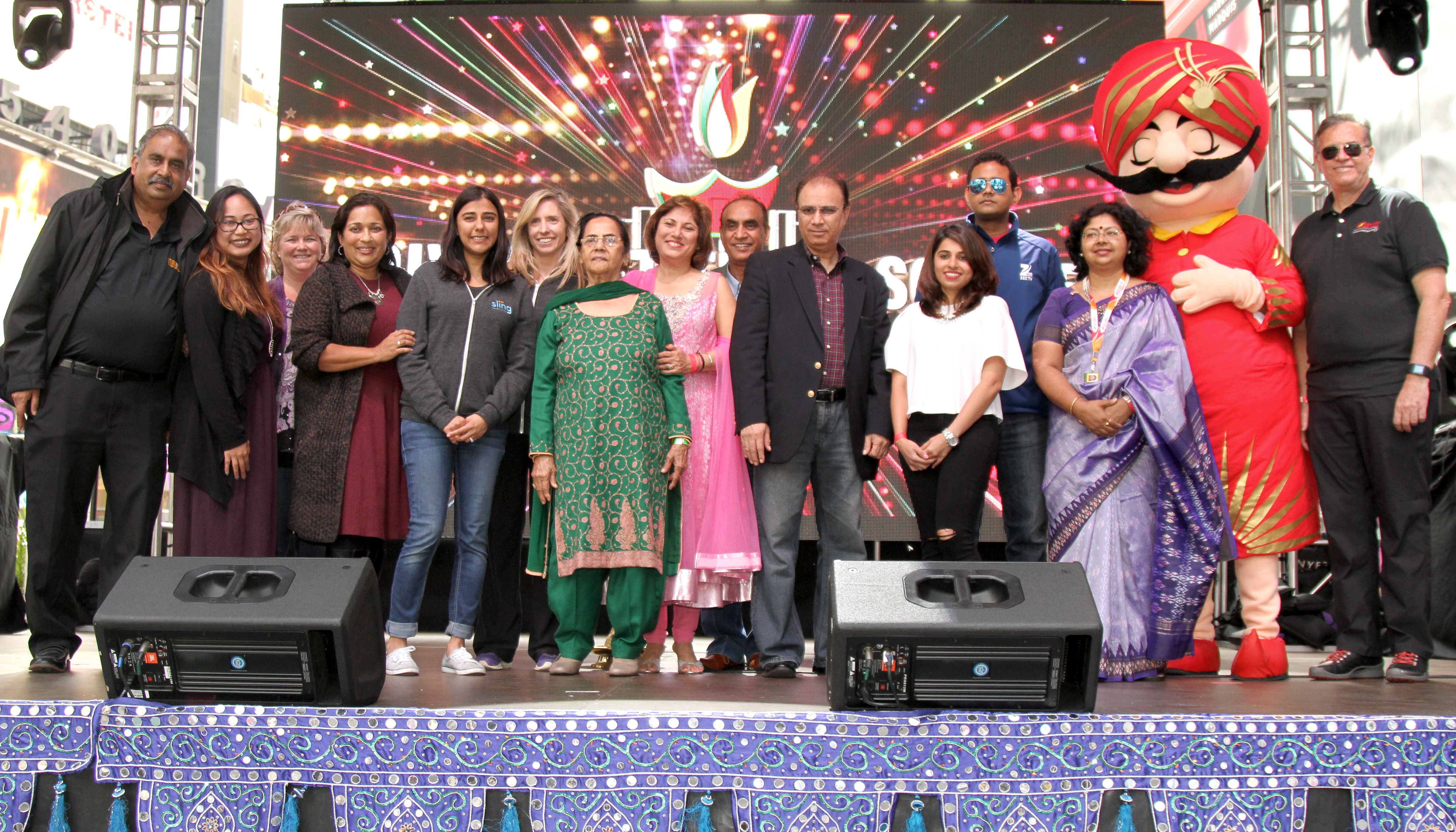 Morning Diya Lighting Ceremony. (Left to Right): Veda Murthy Sarvothaman, Stephanie Judal from WU, Michele Rinn from Prudential, Sharmila Fowler from McDonalds, Elizabeth Riemersma, Dimple Malhotra from Sling Int, Neeta Bhasin, CEO Event Guru, Mrs. Brijbala Suri, Gajendra Suri, Esha Raja, Akhilesh from &TV, Vandana Sharma, Maharaja, John Massey from AirIndia.