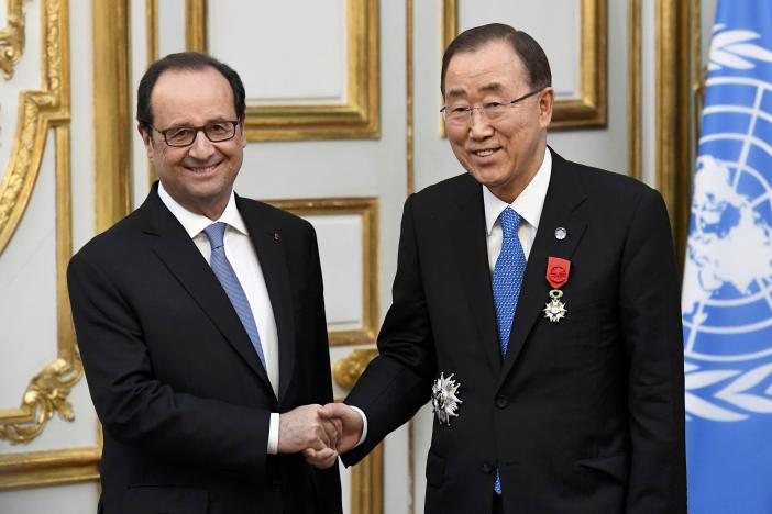 French President Francois Hollande shakes hands with UN Secretary General Ban Ki-moon after awarding him with the Legion of Honour (Legion d’Honneur) at the Elysee Palace in Paris