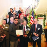 Harbachan Singh (center, holding plaque in left hand) with Democratic leaders