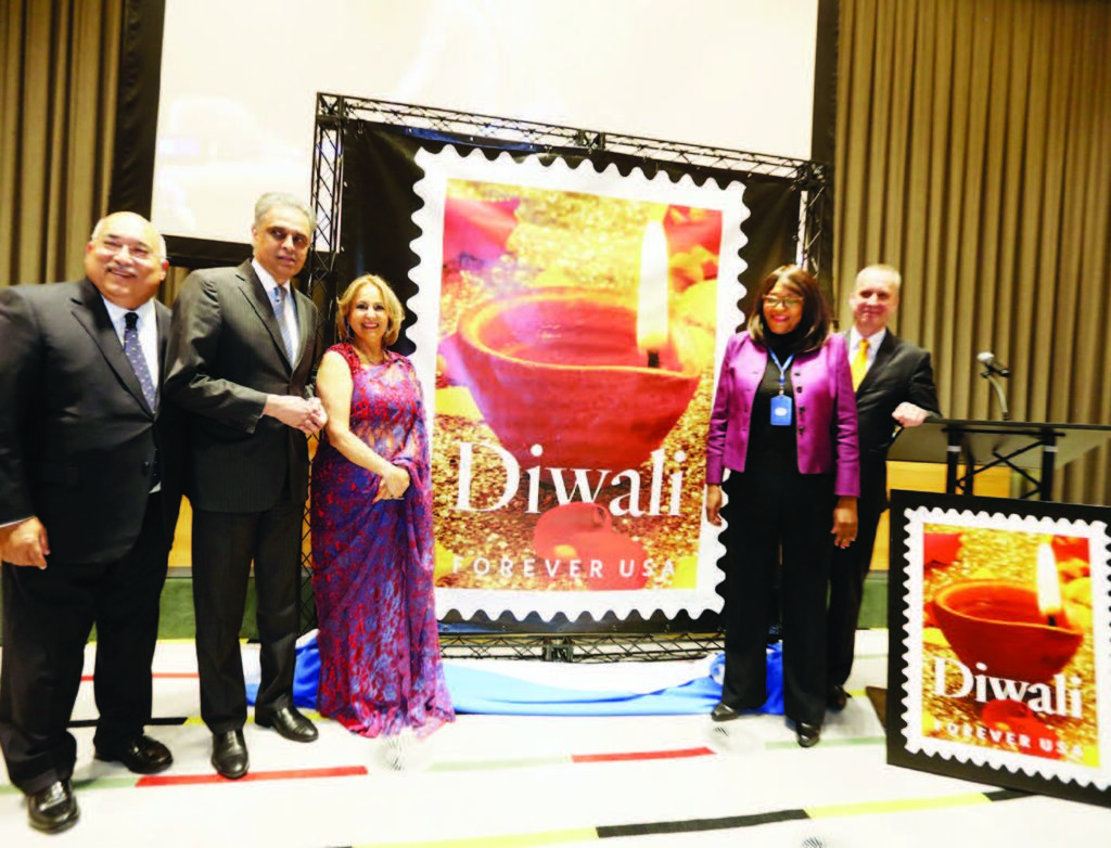 Diwali Stamp is unveiled at the UN. Seen from left to right: Ravi Batra, Ambassador Syed Akbaruddin, Diwali Stamp Project Chair Ranju Batra, Acting President of UN General Assembly Mwaba Patricia Kasese-Bota, and Ambassador Andrei Dapkiunas of Belarus