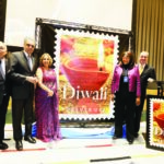 Diwali Stamp is unveiled at the UN. Seen from left to right: Ravi Batra, Ambassador Syed Akbaruddin, Diwali Stamp Project Chair Ranju Batra, Acting President of UN General Assembly Mwaba Patricia Kasese-Bota, and Ambassador Andrei Dapkiunas of Belarus