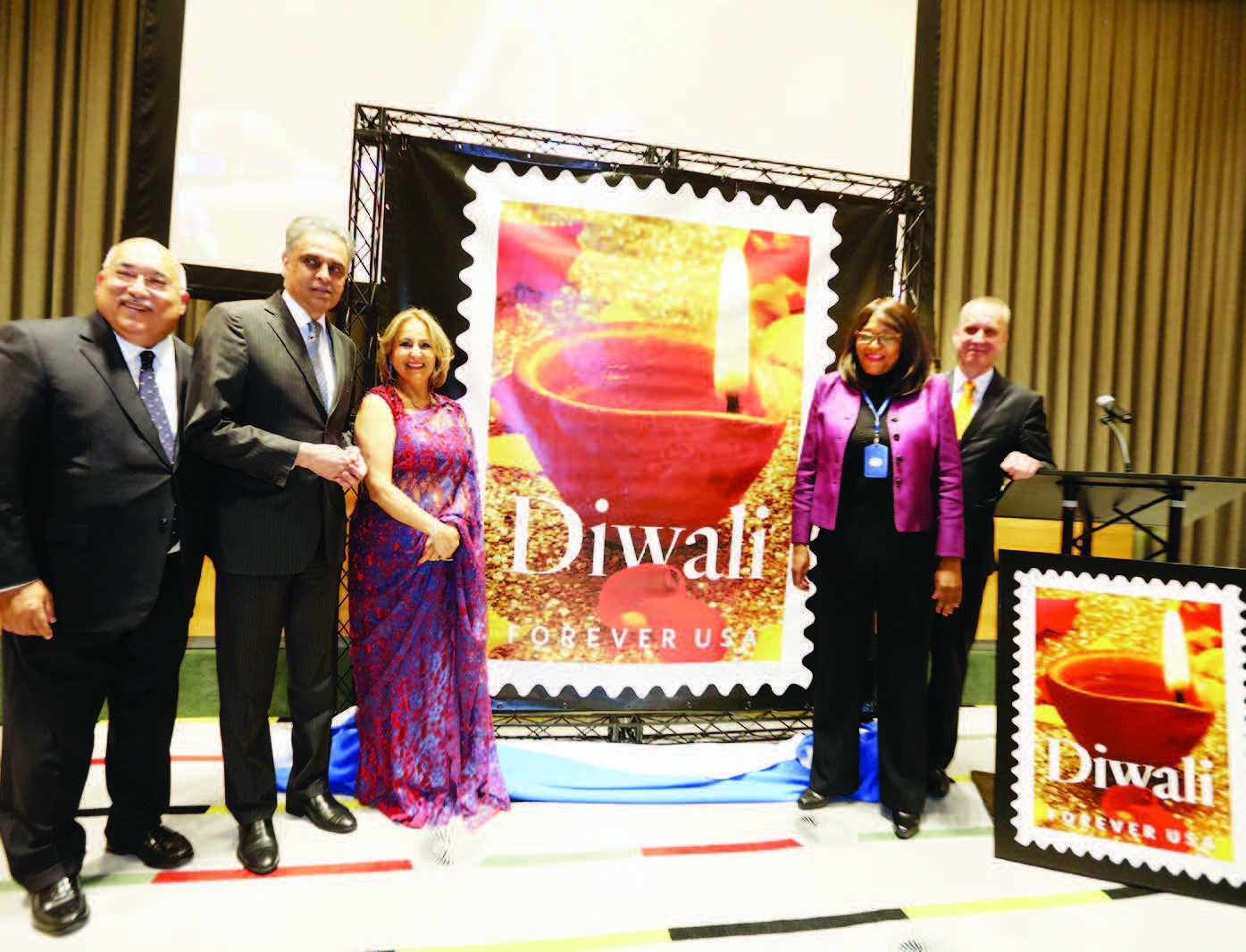 Diwali Stamp is unveiled at the UN. Seen from left to right: Ravi Batra, Ambassador Syed Akbaruddin, Diwali Stamp Project Chair Ranju Batra, Acting President of UN General Assembly Mwaba Patricia Kasese-Bota, and Ambassador Andrei Dapkiunas of Belarus