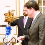 Lighting of the Menorah at the Hanukkah celebrations at Ambassador Sarna's Residence. Ambassador of Israel Ron Dermer (seen in the foreground) and Ambassador of India Navtej Sarna lighting the Menorah.