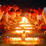 Sri Chinmoy's followers in USA set a Guinness Record by putting 72,585 candles on his 80-Feet-long birthday cake to mark his 85th birth anniversary