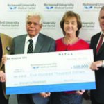 Dr. Krishne Urs, mid-left, making a donation of $500K to Richmond University Medical Center's new emergency department construction project (Image courtesy - silive.com)