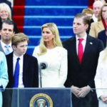 Supreme Court chief justice John Roberts administering the oath of office to Trump, with wife Melania holding the Bible and the Trump family in attendance