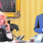 President Donald Trump speaks to Russia''s President Vladimir Putin at the White House, Washington. Chief of Staff Reince Priebus is seen standing (Right).