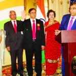 Gobind Munjal (with raised right hand) is sworn in by the immediate Past President Mr Sunil Modi (at the mike). From L to R: Consul General Riva Ganguly Das, Shashi Shah, Gobind Munjal, Mrs. Munjal, Sunil Modi, and Manhattan Borough President Gale Brewer