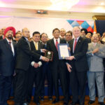 Dr. Manoj Kumar Mohapatra , the Deputy Consul General of India in New York has always been a very welcome guest at community events. One of the latest events where he met with community representative, on March 4, was the inauguration of Prof. Indrajit Singh Saluja, Editor-Publisher of The Indian Panorama, as President of Indo-American Press Club and the felicitation of Mr. HR Shah, Chairman and CEO of TV Asia on conferment on him of one of India’s highest civilian awards, Padma Shri. In the picture, he is seen presenting a plaque to Mr. HR Shah, while the Nassau County Comptroller Mr. George Maragos (right) presented a Nassau County Citation. Also seen from L to R: Purnima Desai, Dilip Chauhan, Jehangir Khattak, Lal Motwani, Prof. Saluja, Dr. VK Raju, Dr. Sudhir Parikh, Dr. D Nori, Srujal Parikh, Rajiv Bhambri, Mohinder Taneja, Dr. Ajay Lodha, Gobind Munjal, Dr. Bhupi Patel Photo/Mohammed Jaffer-SnapsIndia