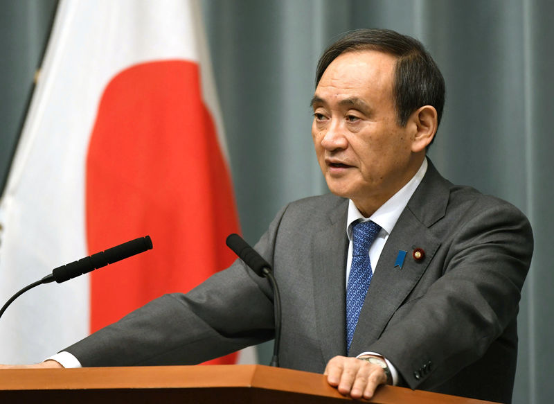 Japan’s Chief Cabinet Secretary Yoshihide Suga speaks to media during a news conference after the reports on the launch of a North Korean missile in Tokyo, Japan