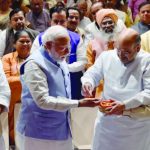 BJP president Amit Shah (right) offers sweets from the Tirupati temple to Prime Minister Narendra Modi as home minister Rajnath Singh looks on during the BJP parliamentary party meeting in New Delhi on March 16.