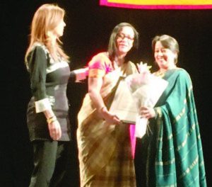 Malini Shah receiving the citation from SOFC President and Consul General of Columbia Maria Isabel Nieto (left) and India's Consul General Riva Ganguly Das