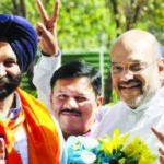 BJP president Amit Shah greets BJP-SAD’s Manjinder Singh Sirsa (left) after his victory in New Delhi.