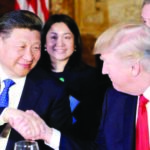President Donald Trump and Chinese President Xi Jinping shake hands during a dinner at Mar-a-Lago