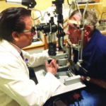 Dr. V. K. Raju examining a patient in his Morgantown clinic