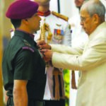 President Pranab Mukherjee presens Shaurya Chakra to Major Rajat Chandra at Rashtrapati Bhawan in New Delhi.