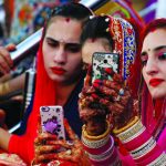 Sikh devotees taking a selfie during the Baisakhi festival at the holy temple of Panja Sahib in Hassan Abdal, Pakistan April 14, 2017. Photo: REUTERS