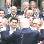 A jubilant Donald Trump congratulates House Republicans after they passed legislation aimed at repealing and replacing Obamacare, during an event in the Rose Garden at the White House, on May 4, 2017 in Washington, DC.