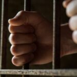 Behind-bars-590×260