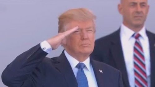 Trump taking salute