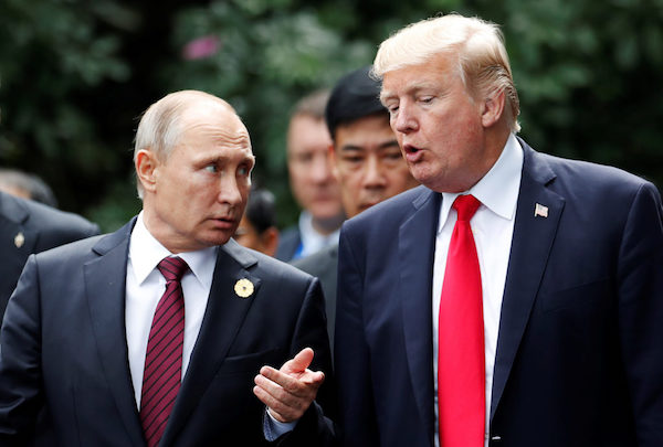 U.S. President Donald Trump and Russia’s President Vladimir Putin talk during the family photo session at the APEC Summit in Danang, Vietnam