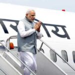 PM Modi disembarking from a plane