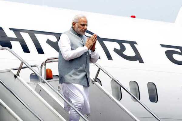PM Modi disembarking from a plane