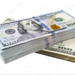 Stack of one hundred dollar bills isolated on white background.