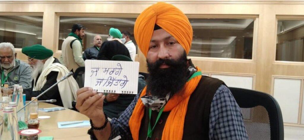 A farmer at the meeting displays the resolve of farmers Either will win or die