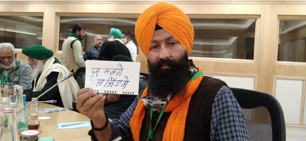 A farmer at the meeting displays the resolve of farmers Either will win or die