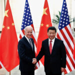 FILE PHOTO: Chinese President Xi Jinping shakes hands with U.S. Vice President Joe Biden inside the Great Hall of the People in Beijing