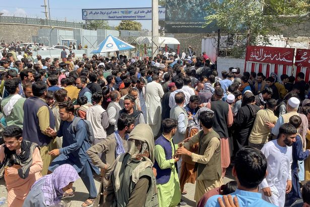 People thronging the Hamid Karzai Airport in Kabul trying to flee Afghanistan