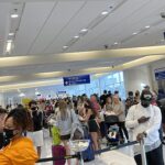 Travelers at Spirit Airlines counters at Dallas Fort Worth airport August 2