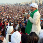 BKU leader Rakesh Tikait addresses a