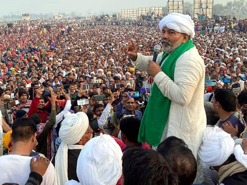 BKU leader Rakesh Tikait addresses a