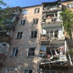 Damaged residential building is seen at the site of the missile strike in Mykolaiv